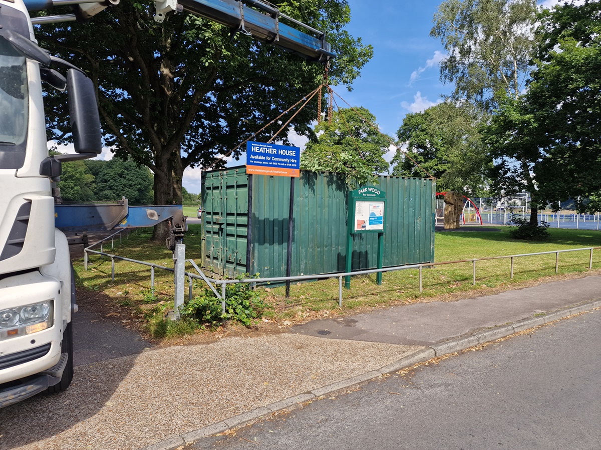 Building materials being lifted into position on site
