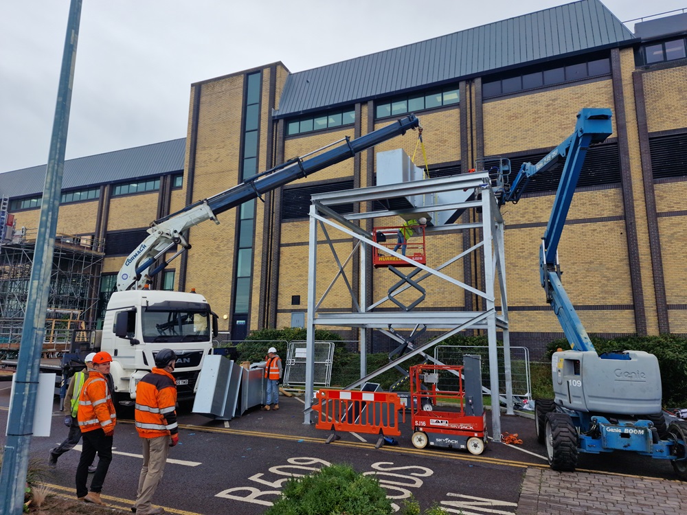 Container being transported and placed on location