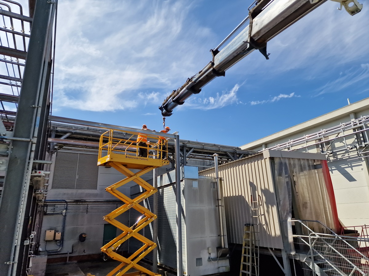 Truck-mounted HIAB crane in operation on a job site