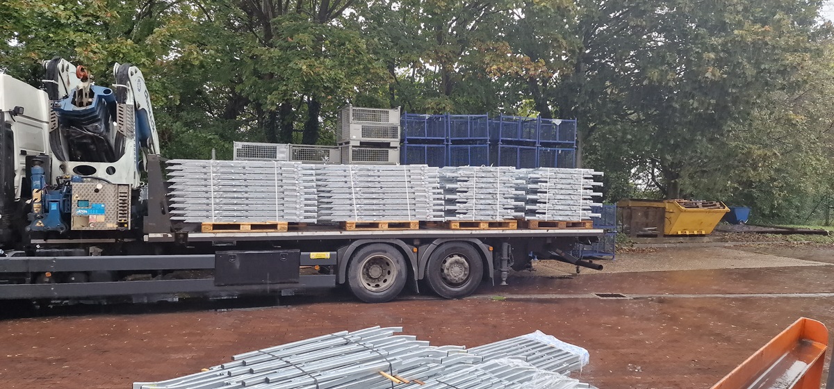 Heavy steel beam being transported and installed in Kent