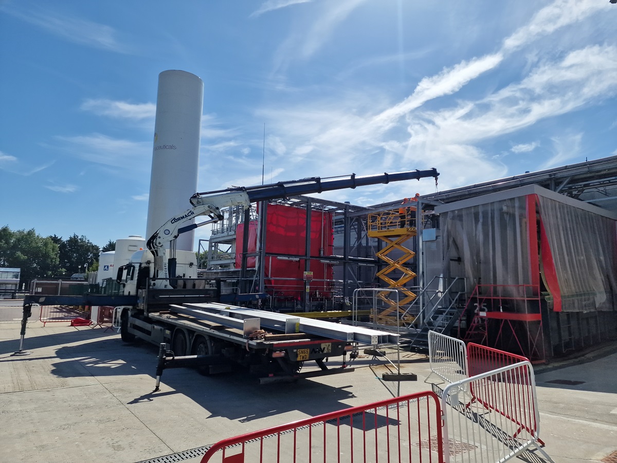 Transport truck with crane arm extended